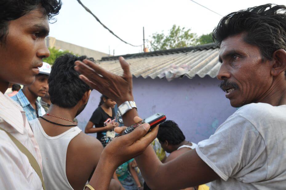A Citizen Journalist Interviewing a Local Resident in India
